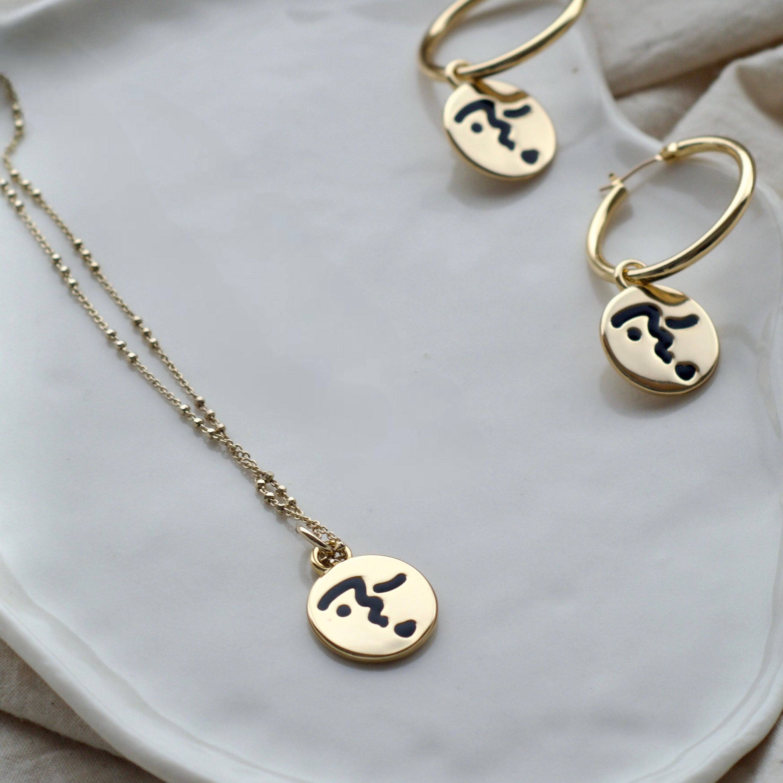 Heart lip face hoop earrings