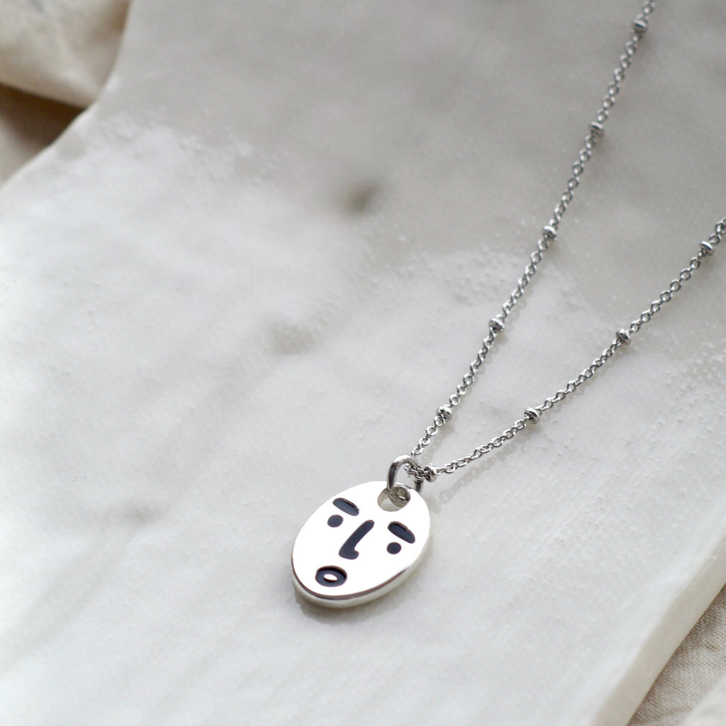 Clueless face necklace