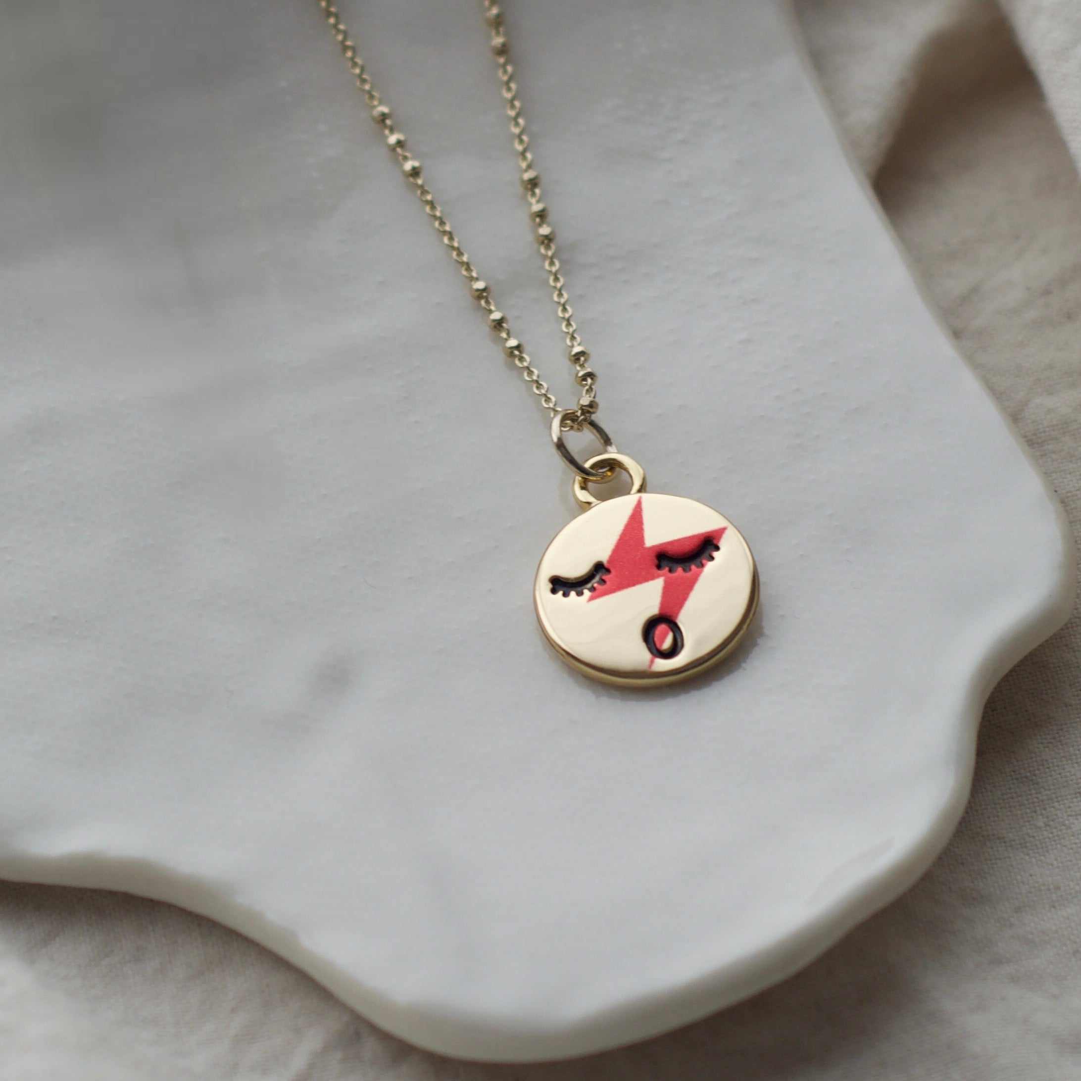 Red lightening face neckace