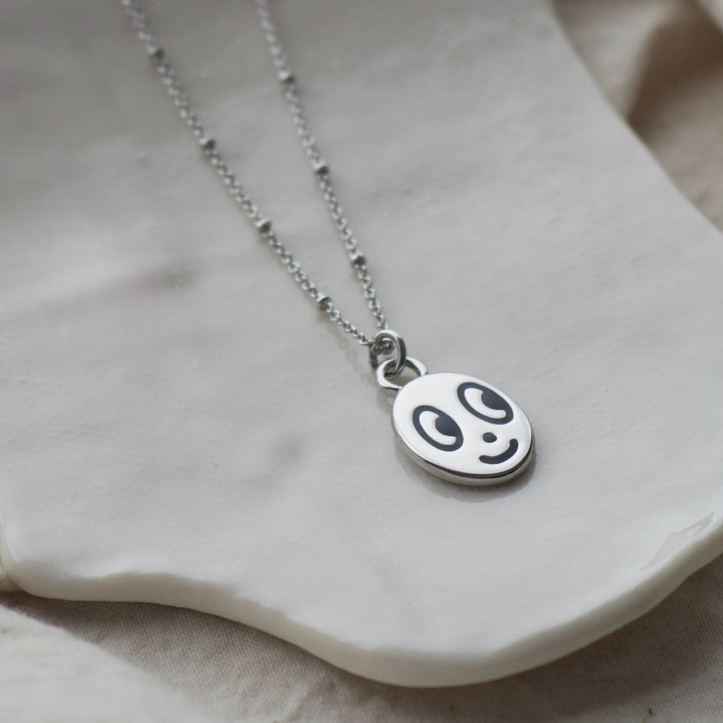 Big eyed smiley face necklace