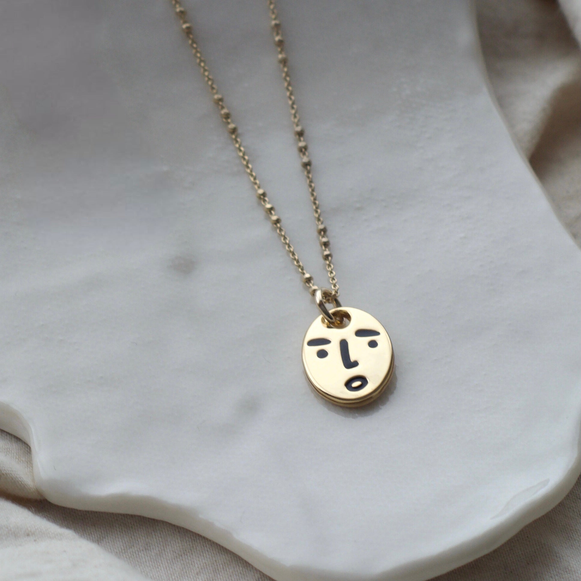 Clueless face necklace