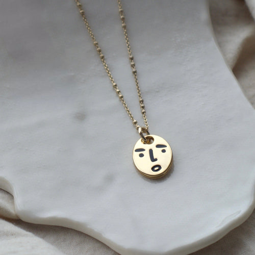 Clueless face necklace