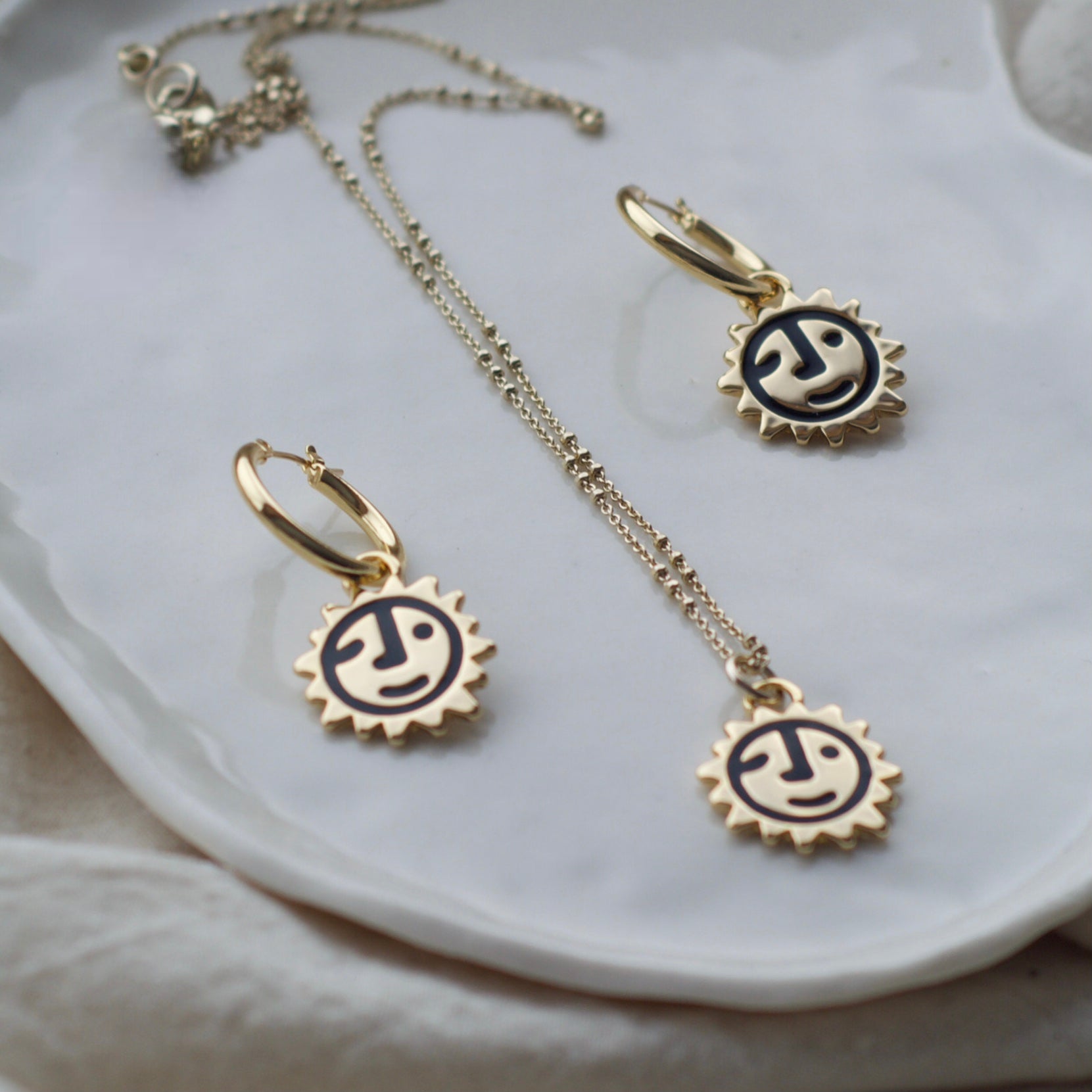 Sunny lion face hoop earrings