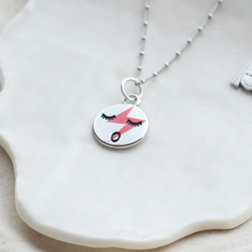 Red lightening face necklace