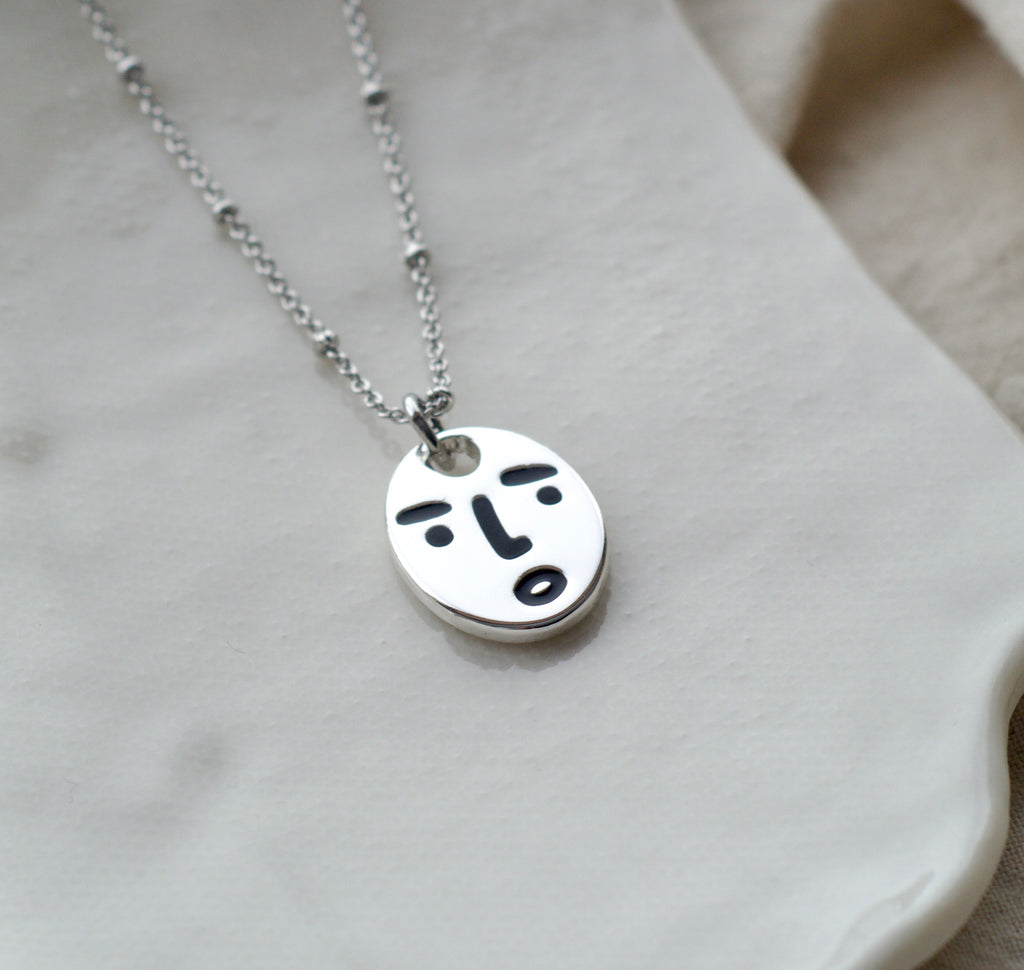 Clueless face necklace