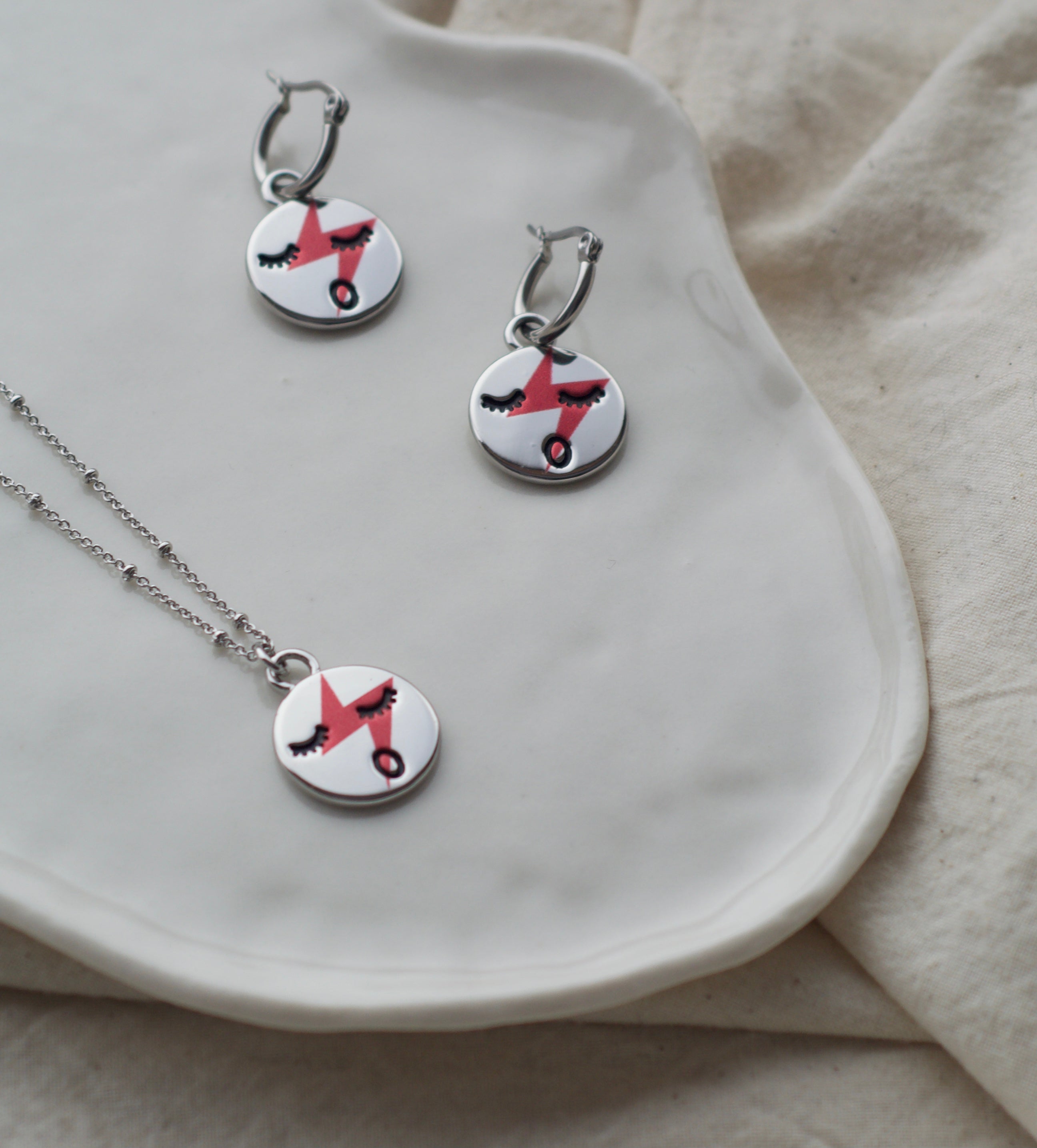 Red lightening face necklace