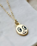 Big eyed smiley face necklace