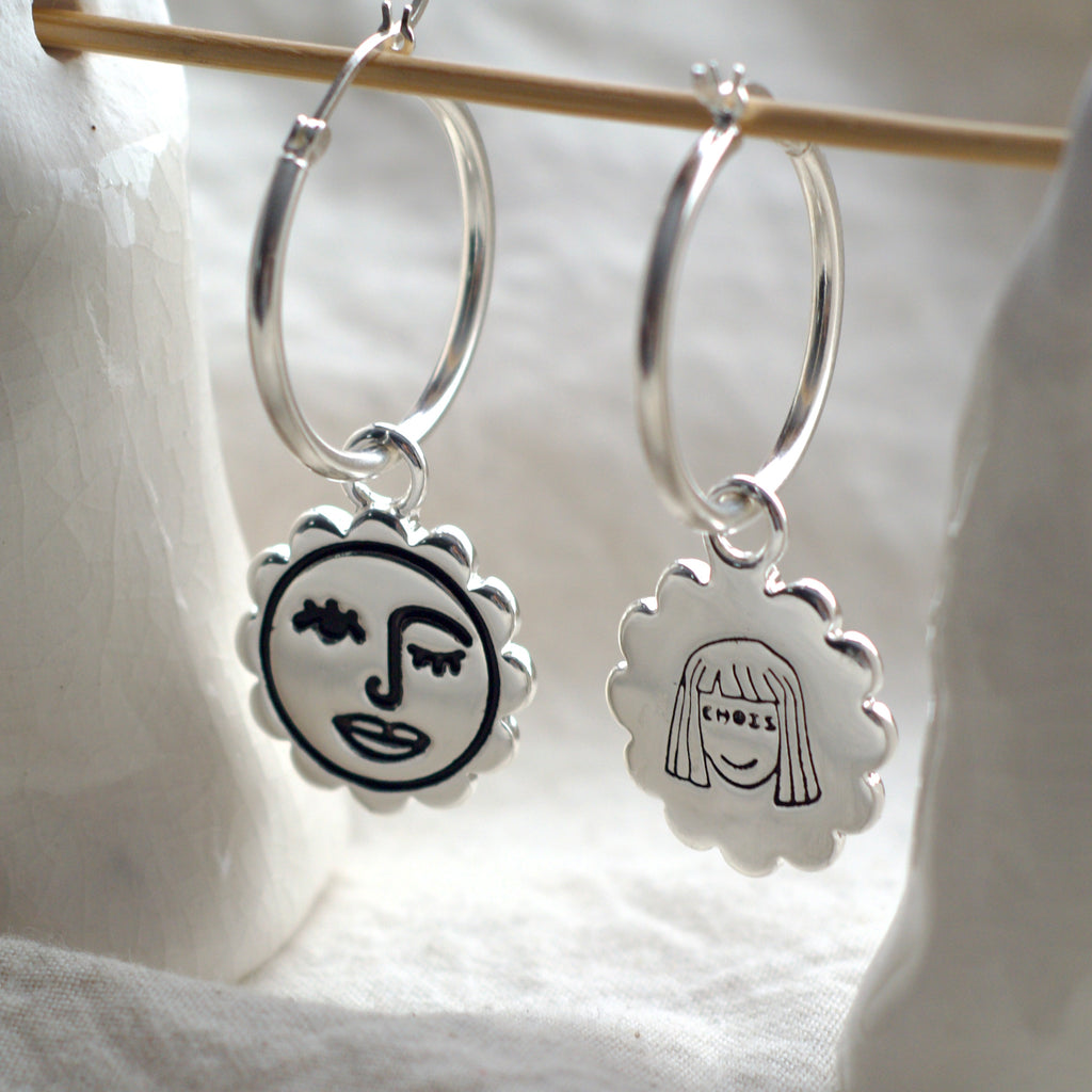 Winking sun face hoop earrings