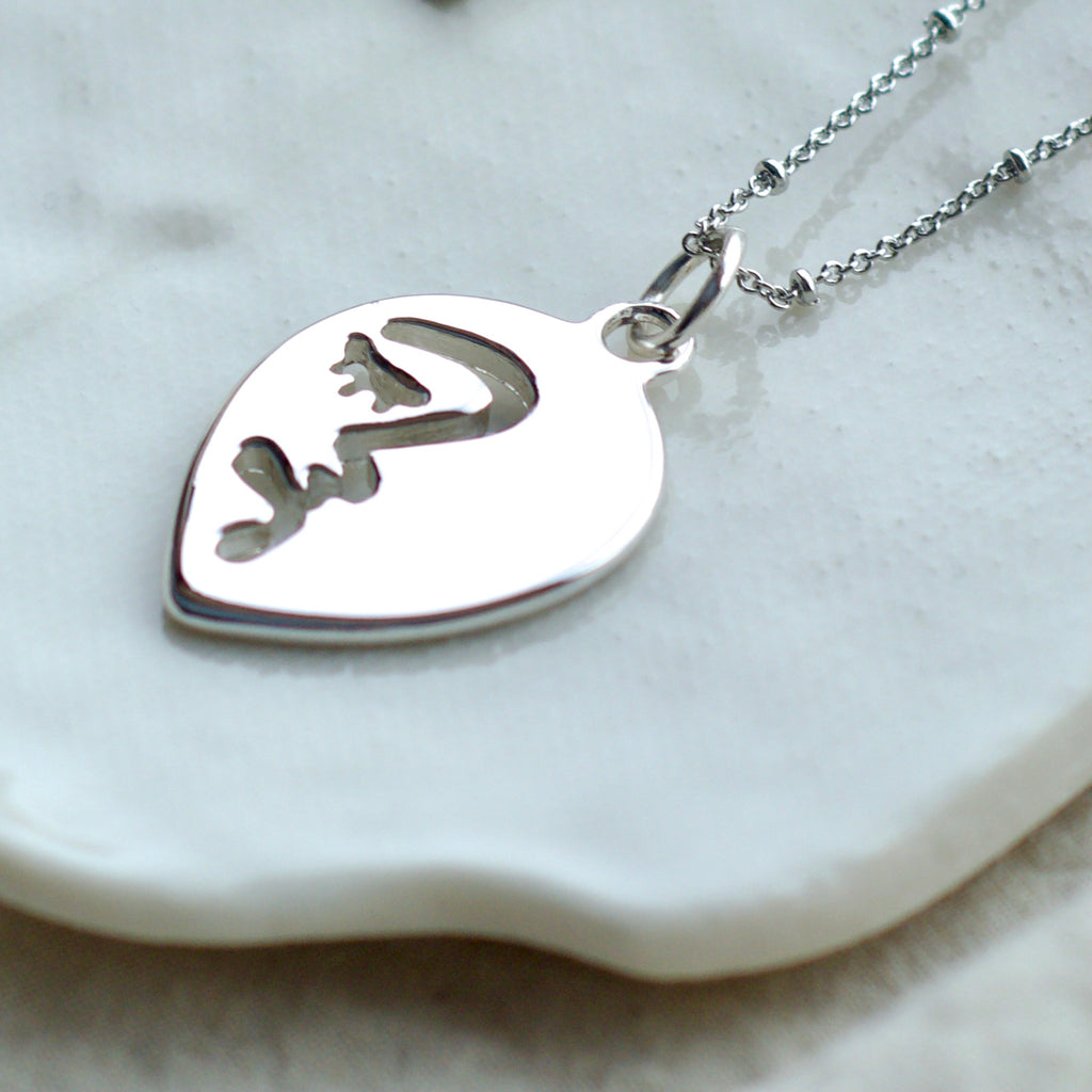 Half abstract face necklace