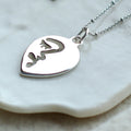 Half abstract face necklace