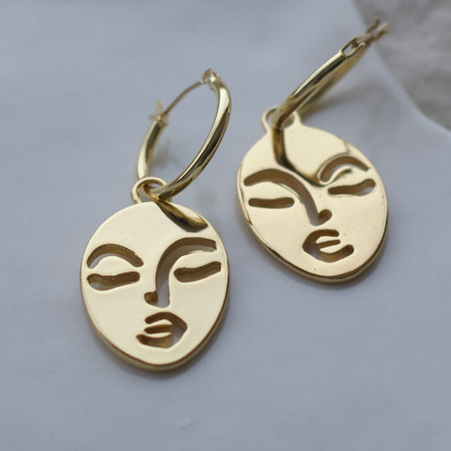 Calm and Sallow face hoop earrings