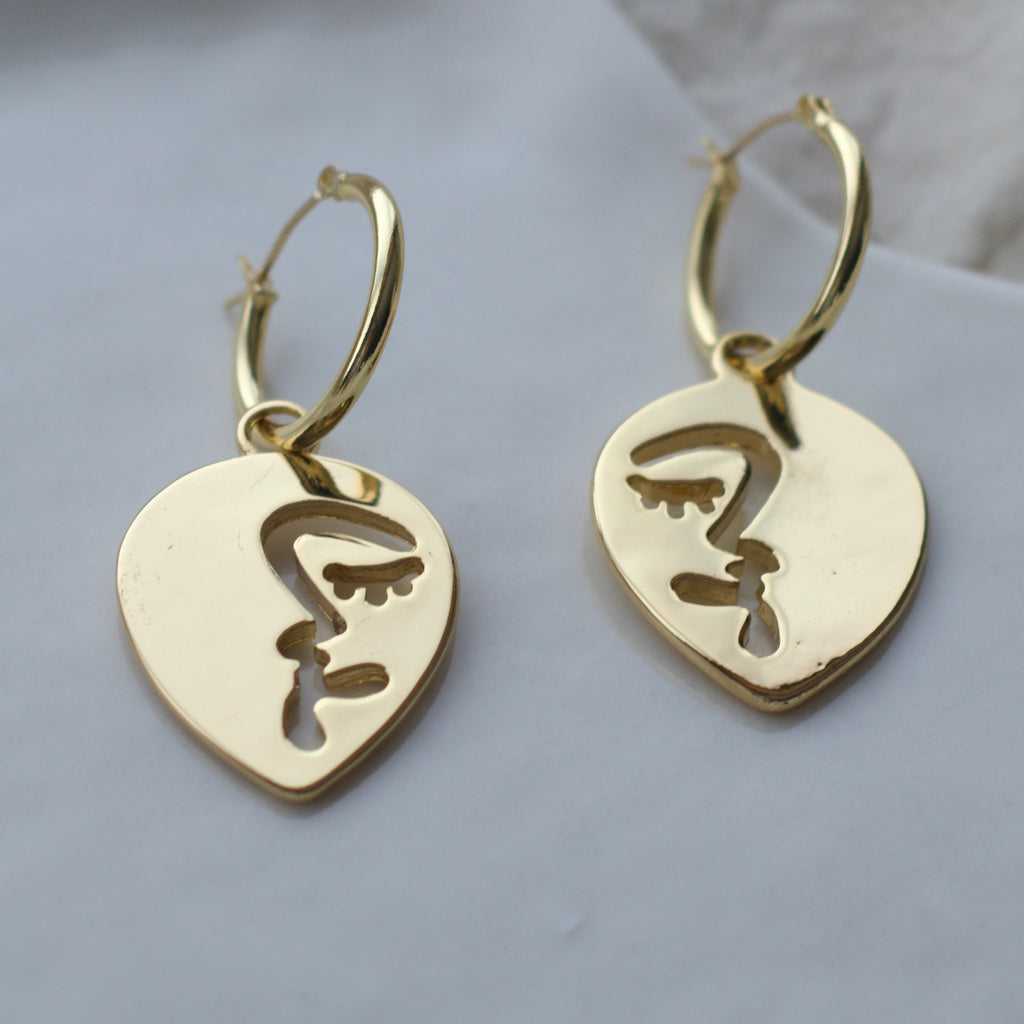 Half abstract face hoop earrings