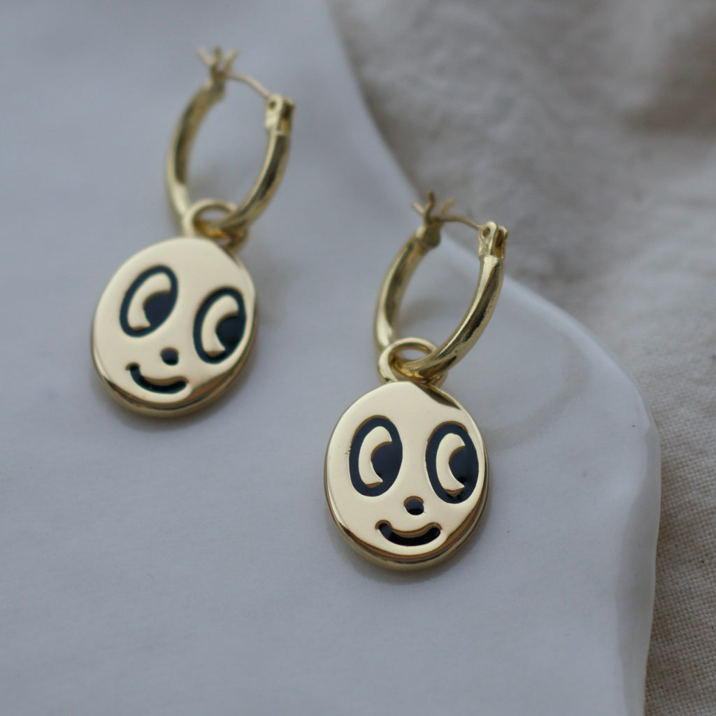 Big eyed smiley face hoop earrings