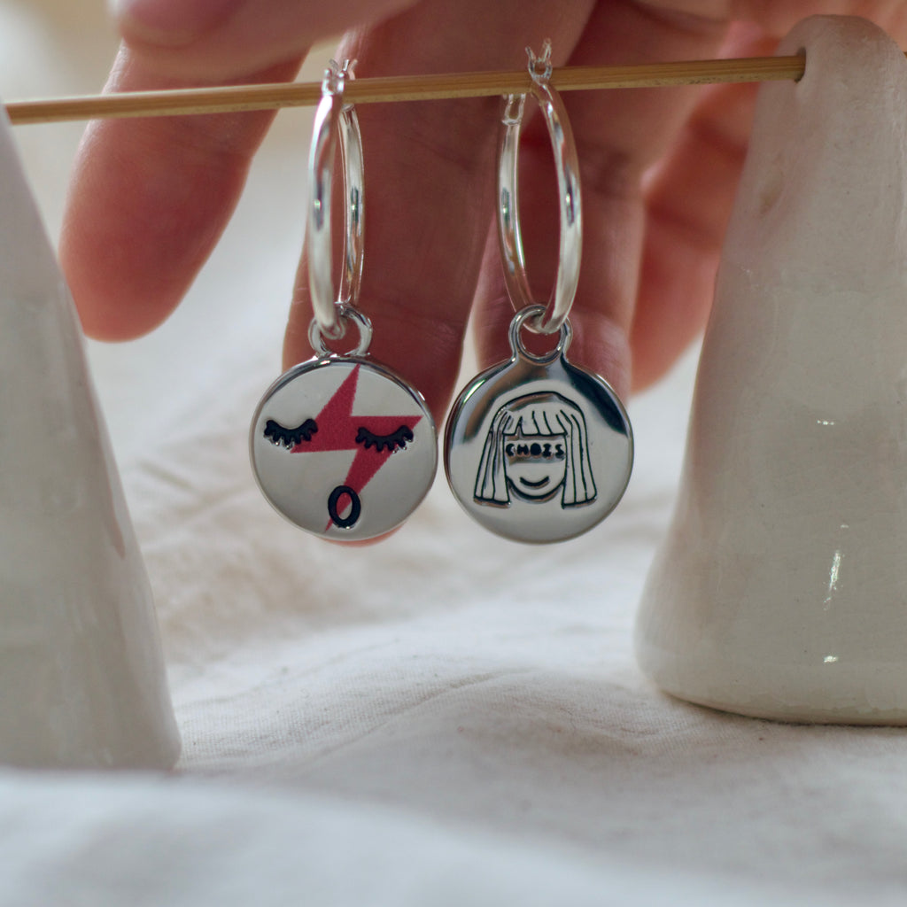 Red lightening face hoop earrings