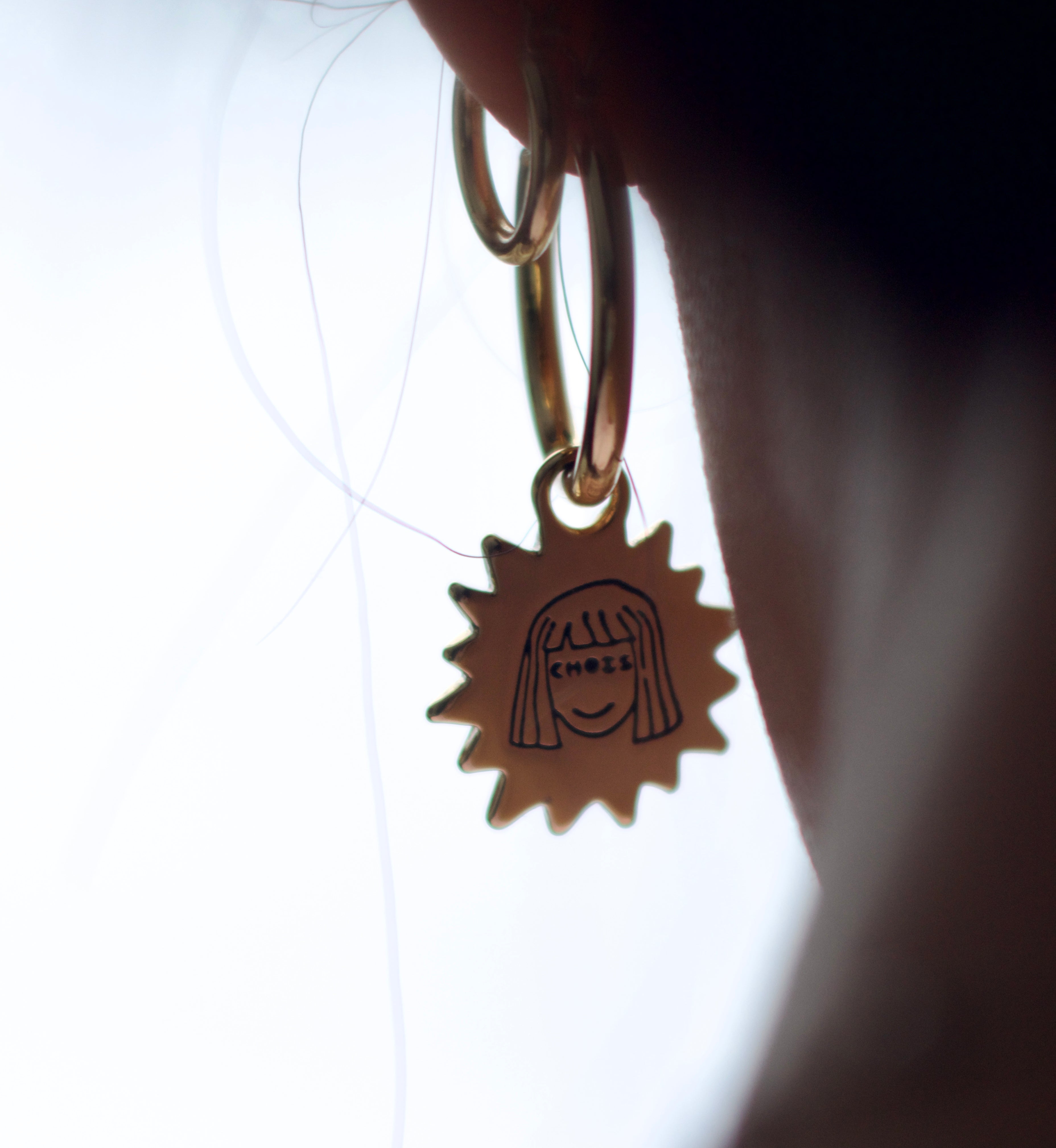 Sunny lion face hoop earrings