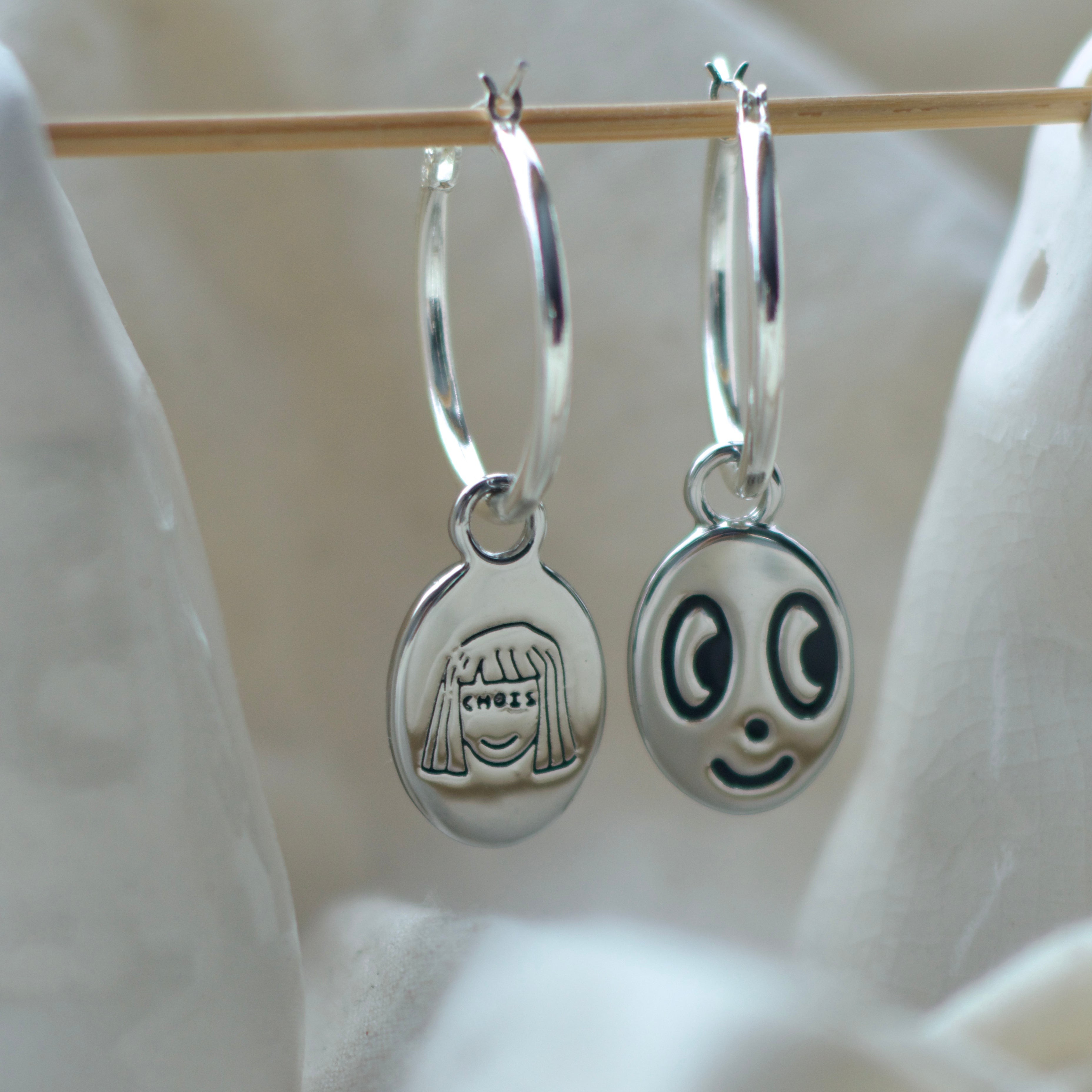 Big eyed smiley face hoop earrings
