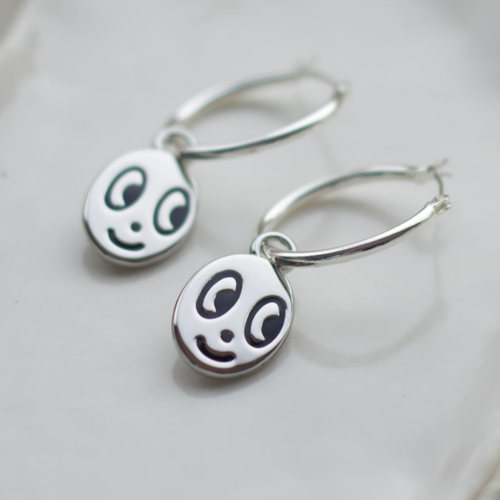 Big eyed smiley face hoop earrings