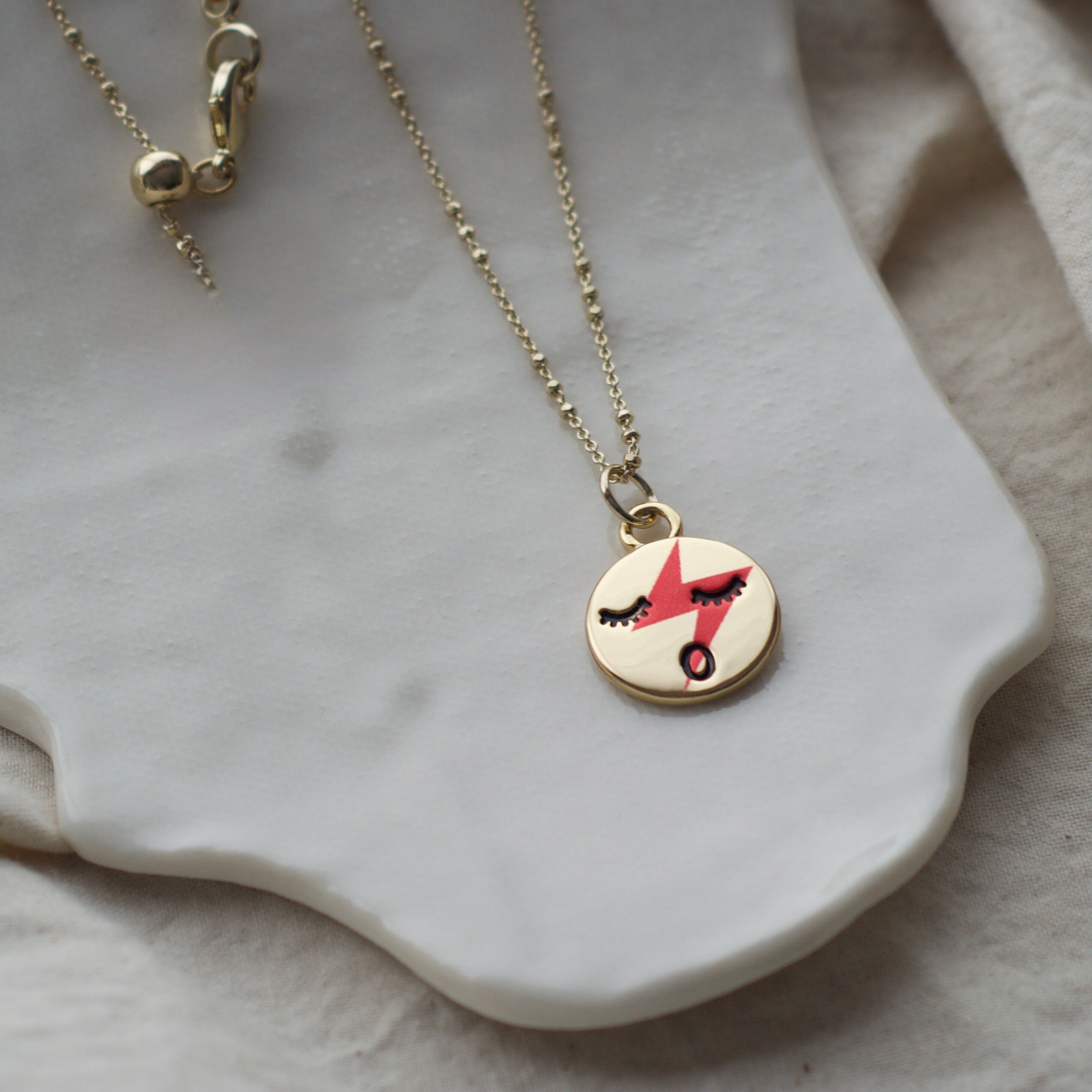 Red lightening face neckace