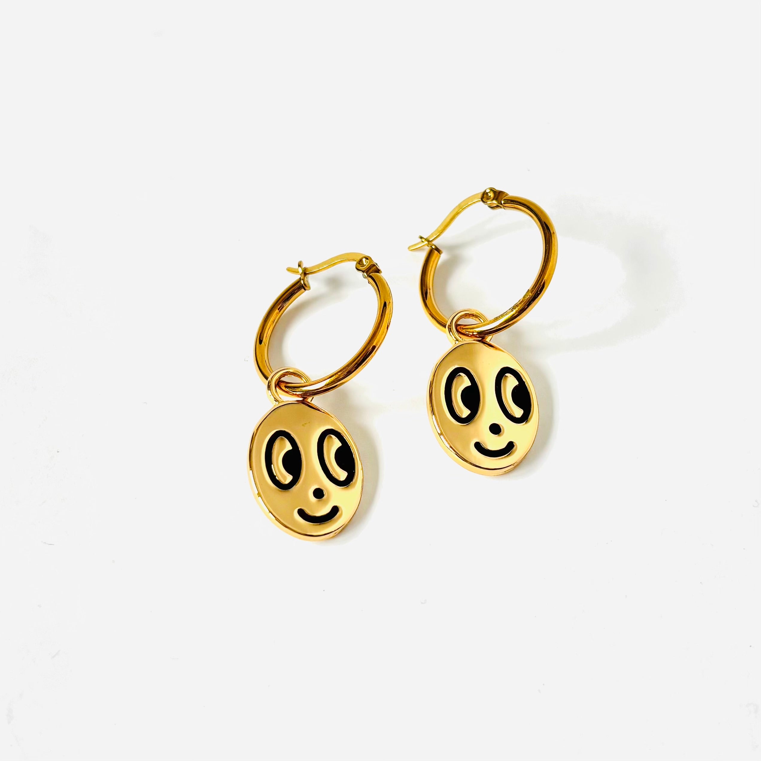 Big eyed smiley face hoop earrings