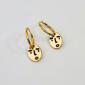 Clueless face hoop earrings