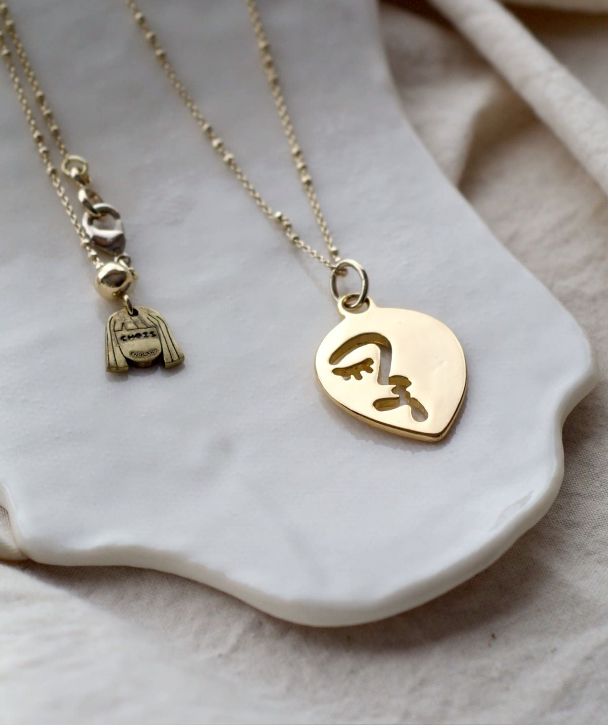 Half abstract face necklace