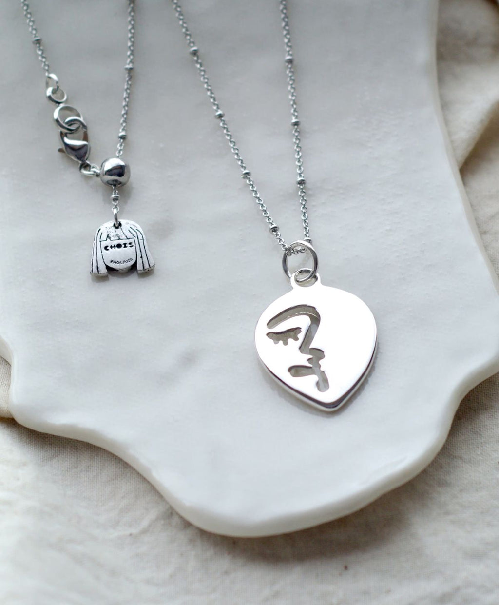 Half abstract face necklace