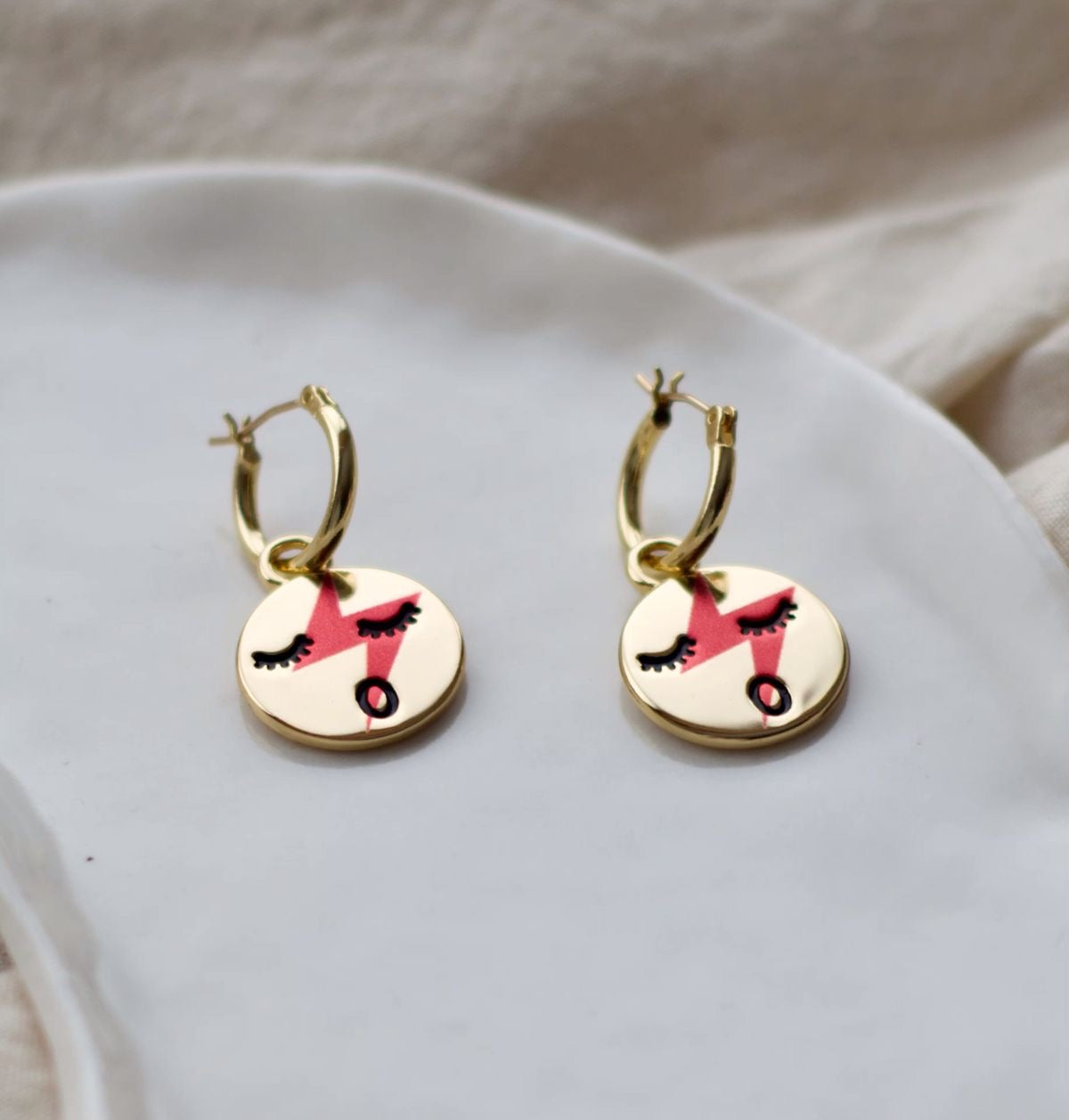 Red lightening face hoop earrings