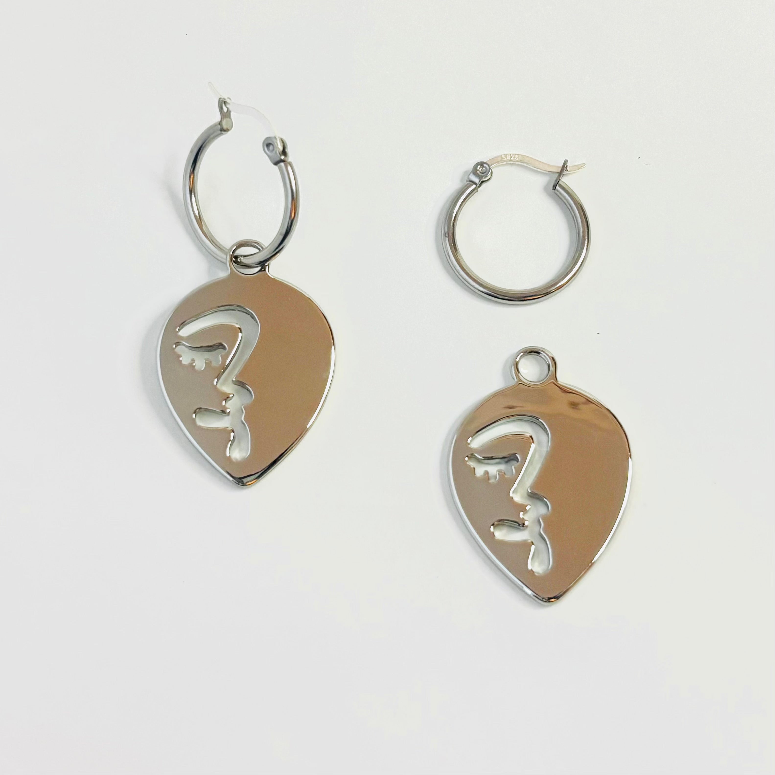 Half abstract face hoop earrings