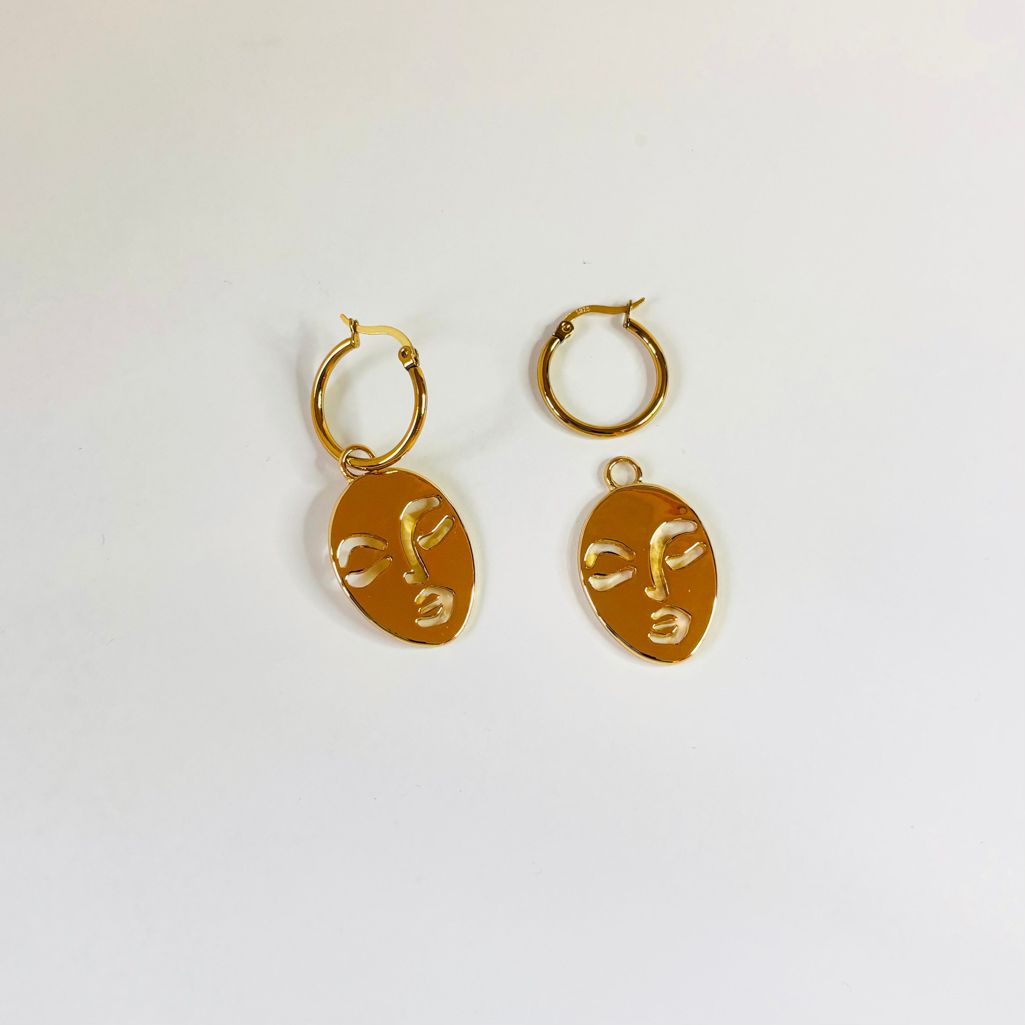 Calm and Sallow face hoop earrings