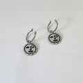 Winking sun face hoop earrings