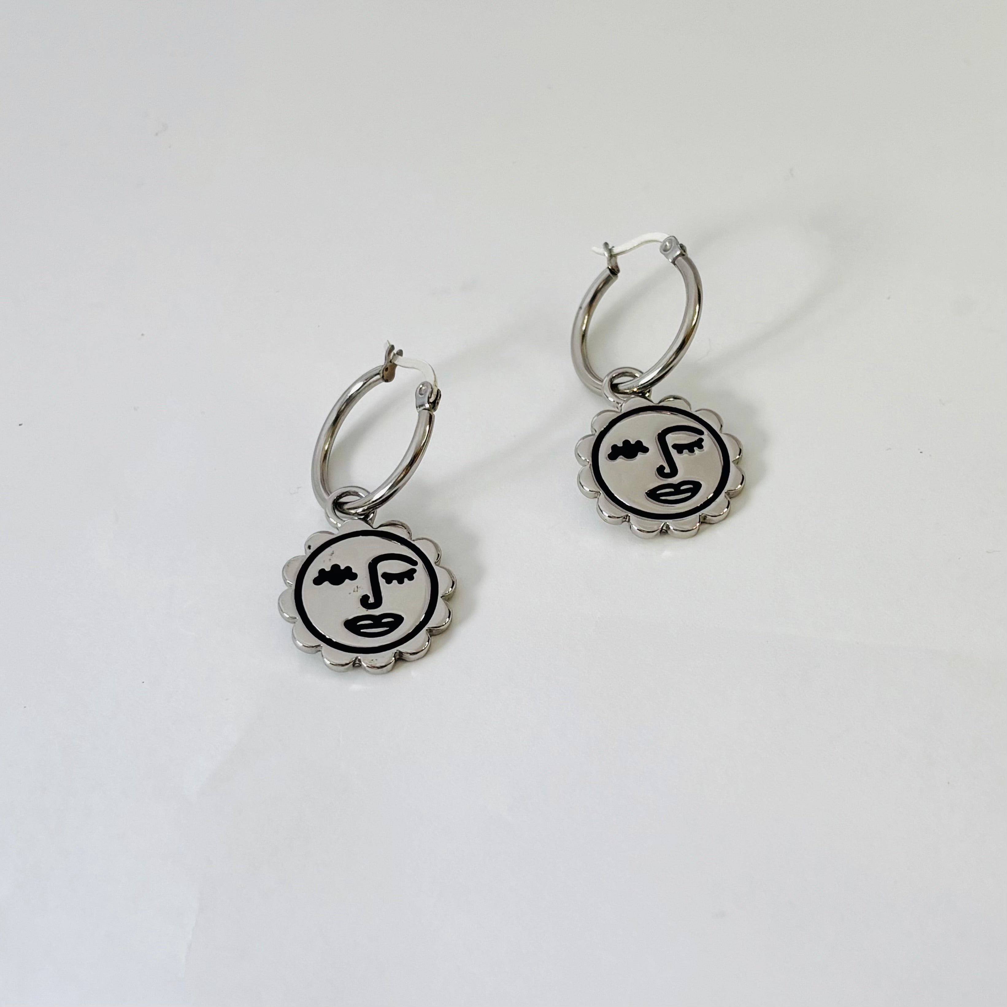 Winking sun face hoop earrings