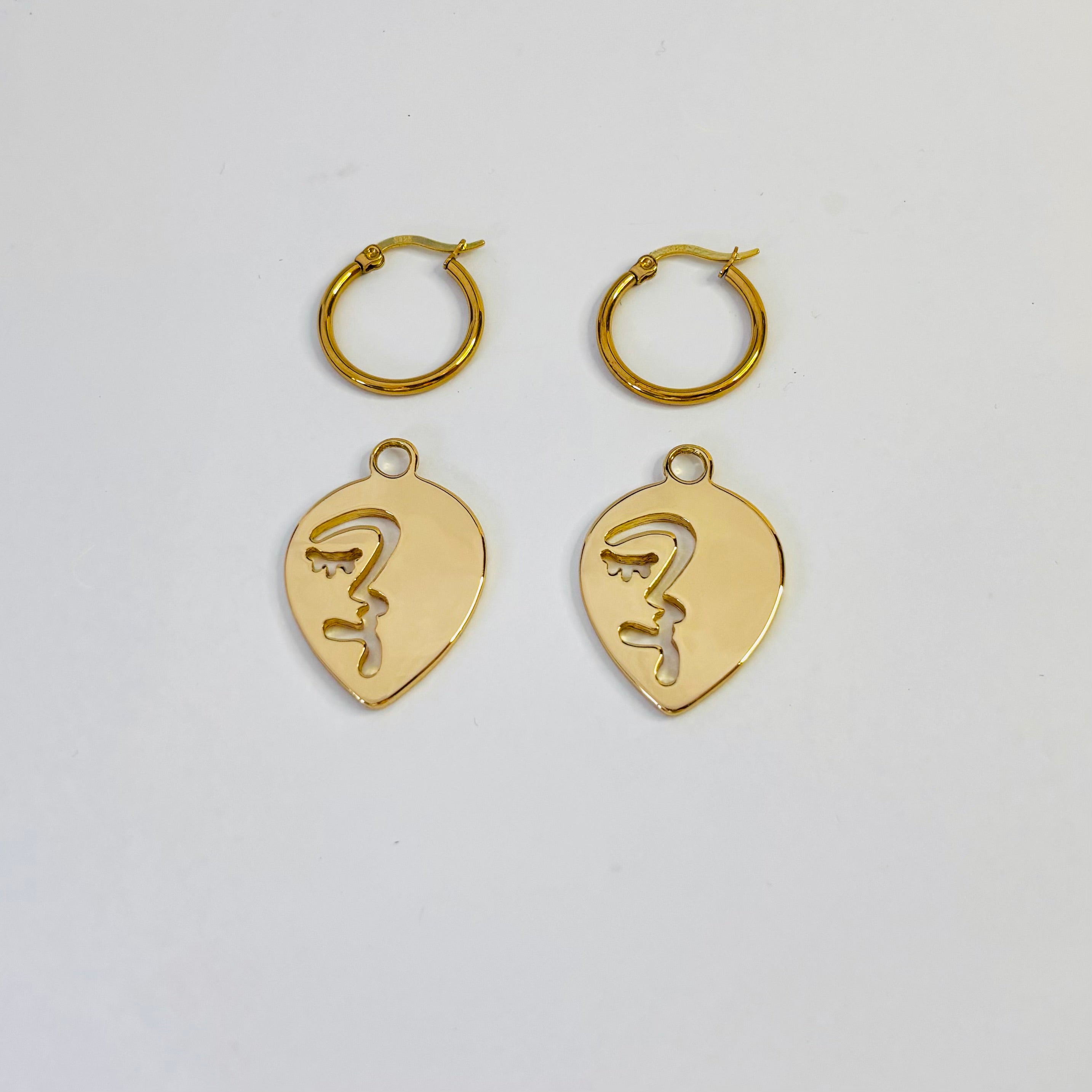 Half abstract face hoop earrings
