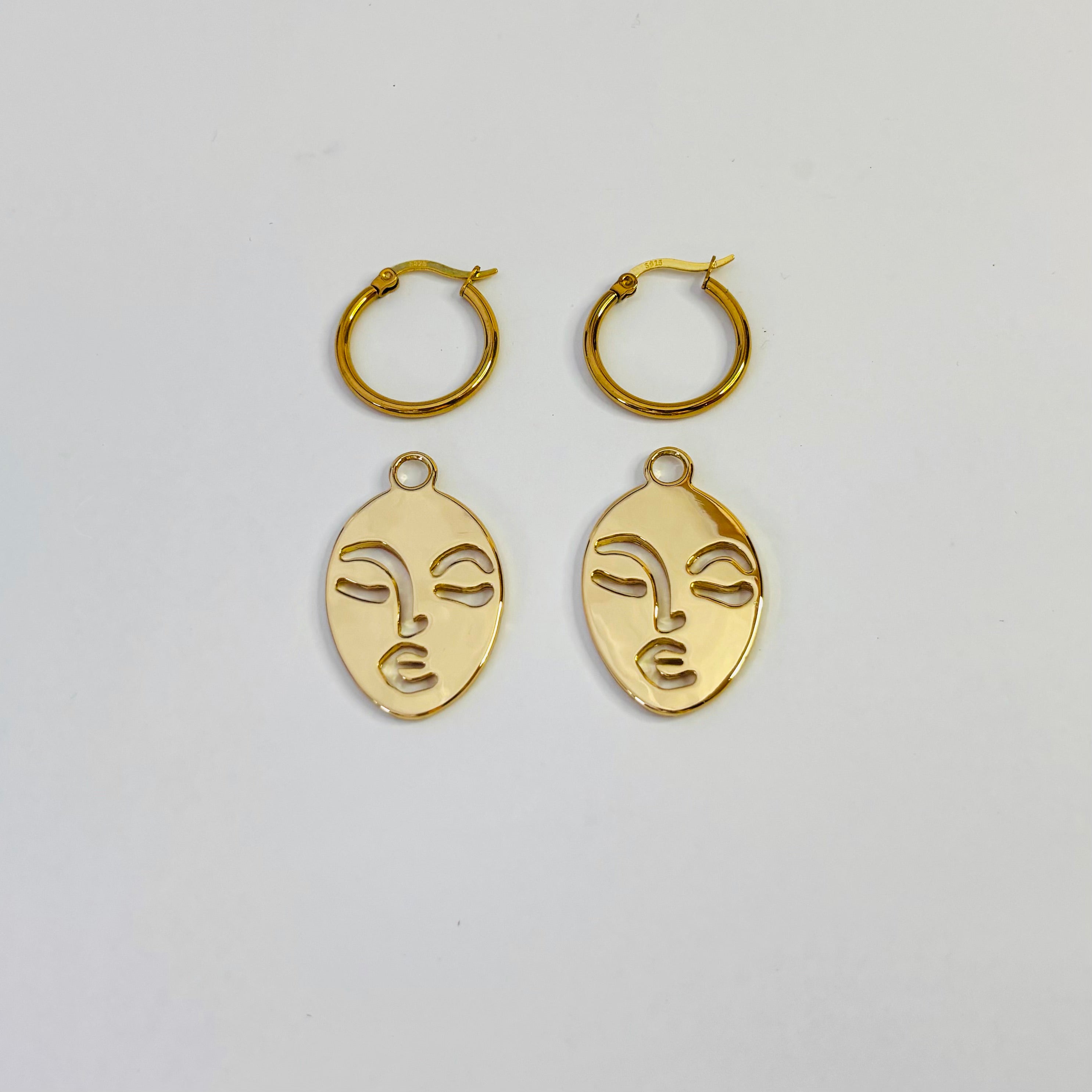 Calm and Sallow face hoop earrings