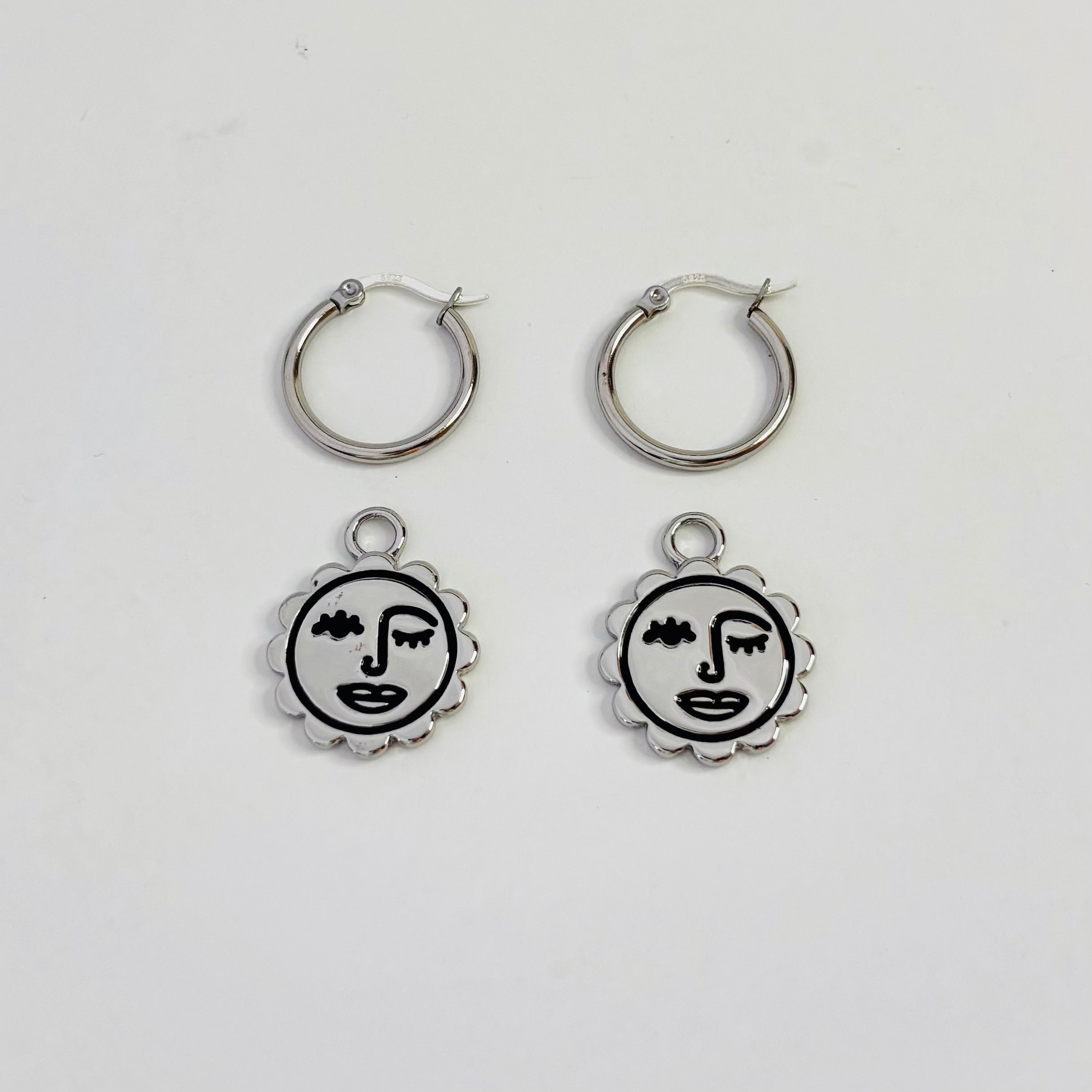 Winking sun face hoop earrings