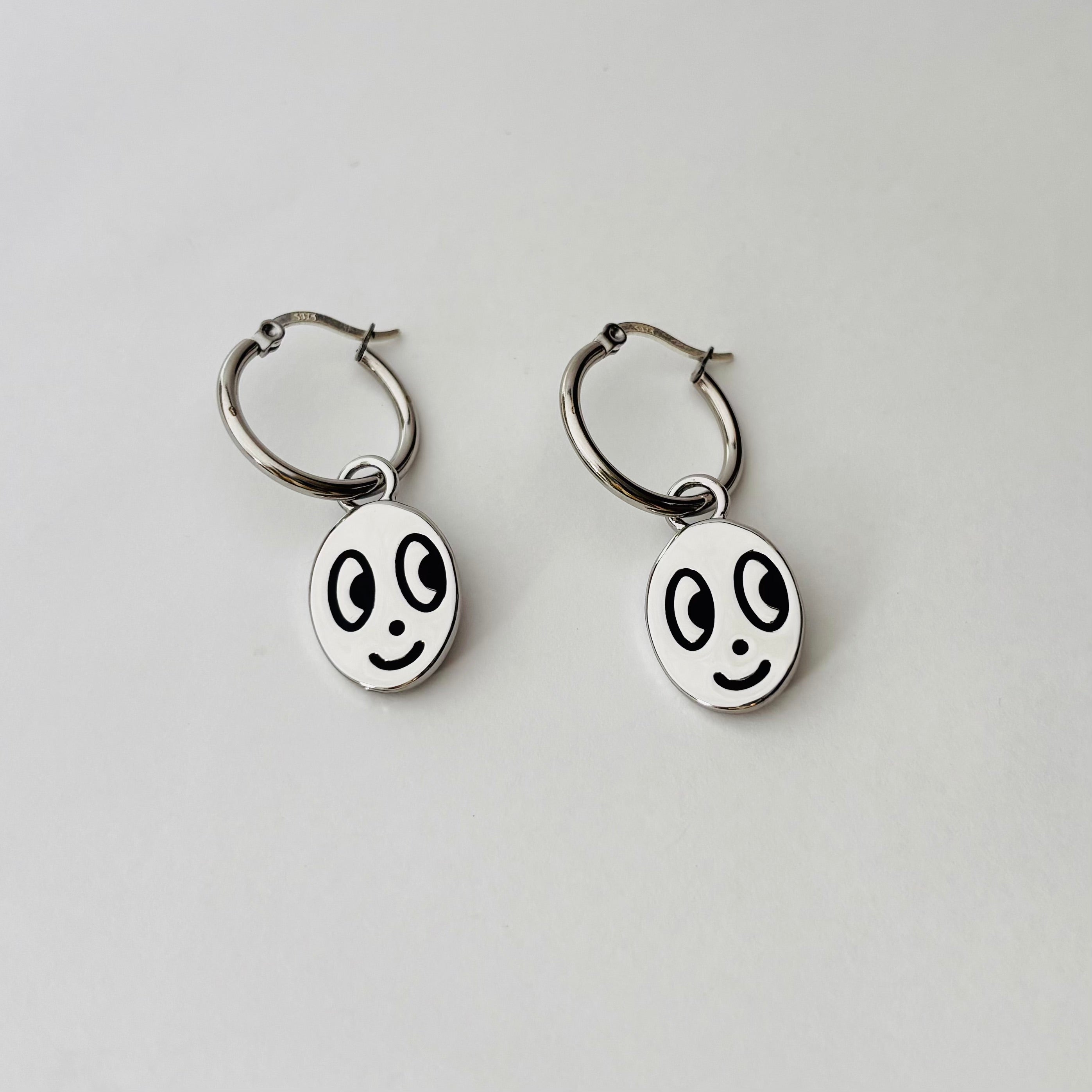 Big eyed smiley face hoop earrings