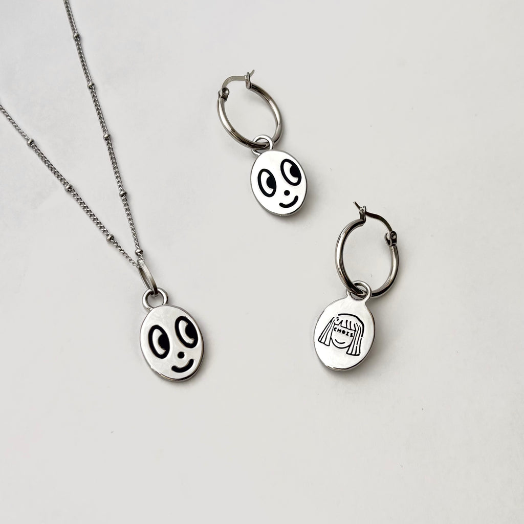 Big eyed smiley face hoop earrings