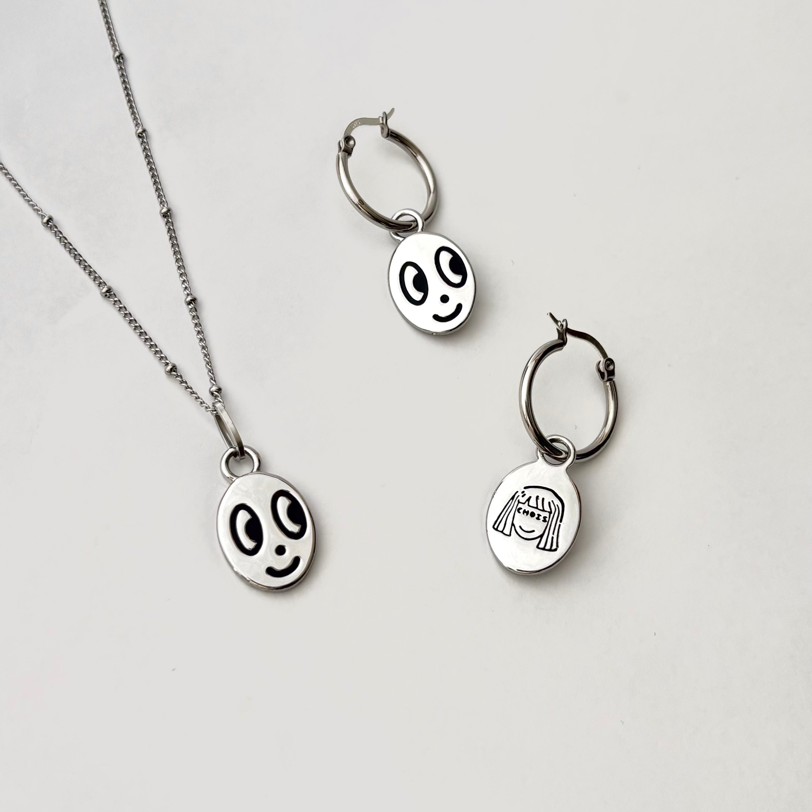 Big eyed smiley face hoop earrings